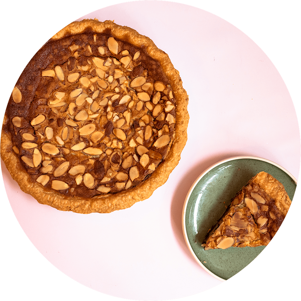 Black bottom almond chess pie with chocolate ganache base and buttermilk custard filling at Petee's Pie NYC bakery