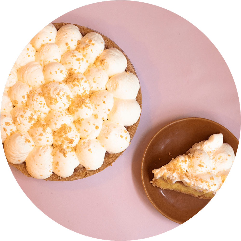 Fresh banana cream pie with whipped cream topping and graham crust at Petee's Pie NYC bakery