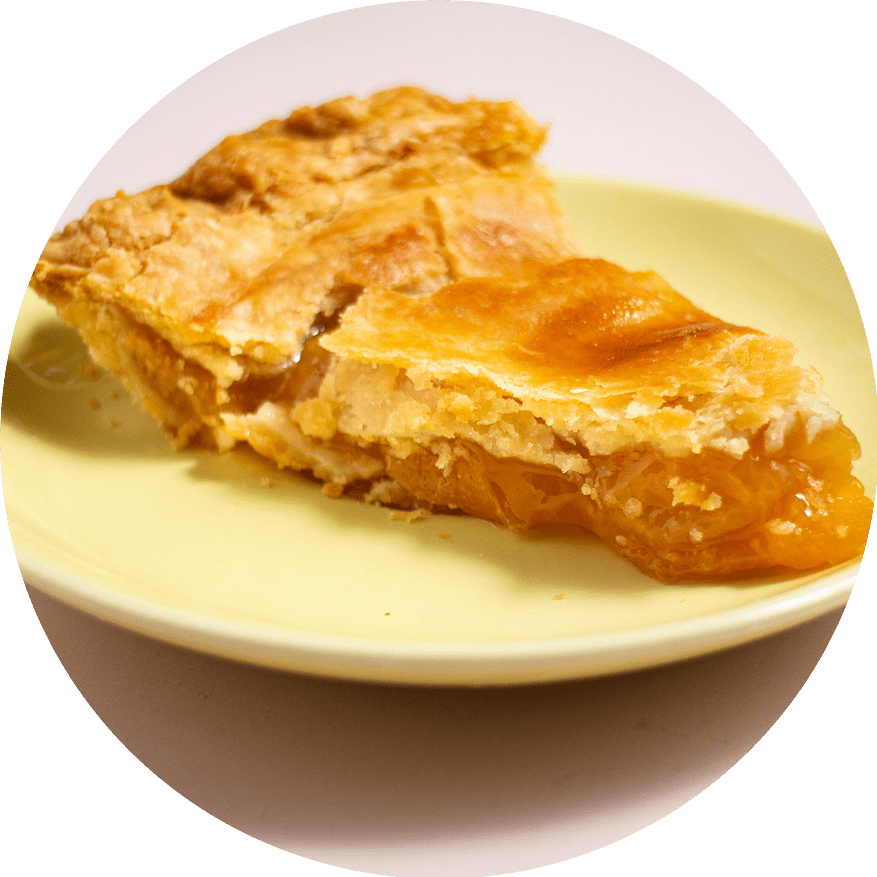 Jersey peach pie slice with fresh summer peaches and flaky pastry crust from Petee's Pie Company NYC