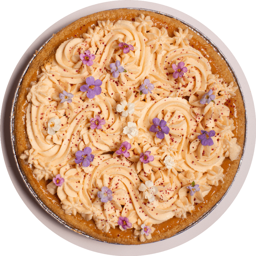 Guava mascarpone pie with tropical guava curd and purple blossoms from Petee's NYC bakery
