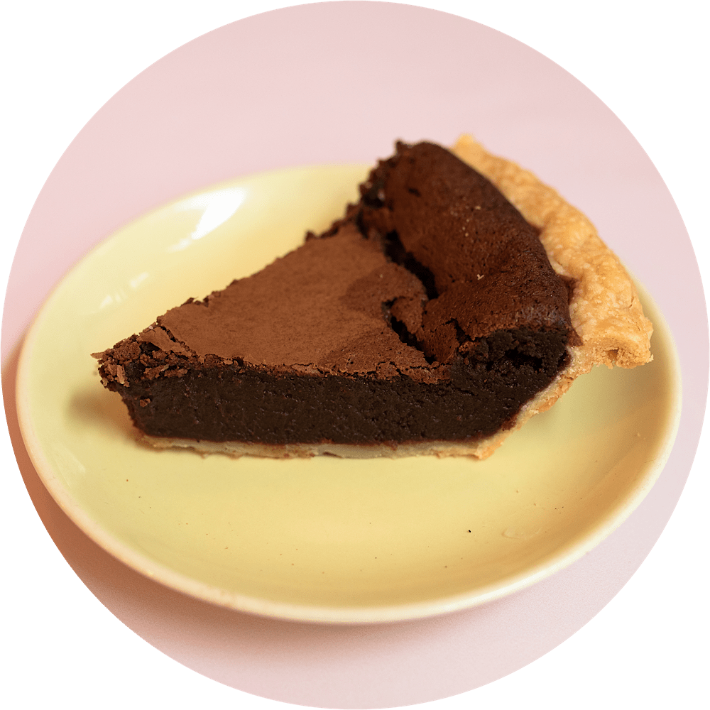 Chocolate chess pie slice with rich buttermilk filling, cocoa and sea salt from Petee's Pie Company NYC