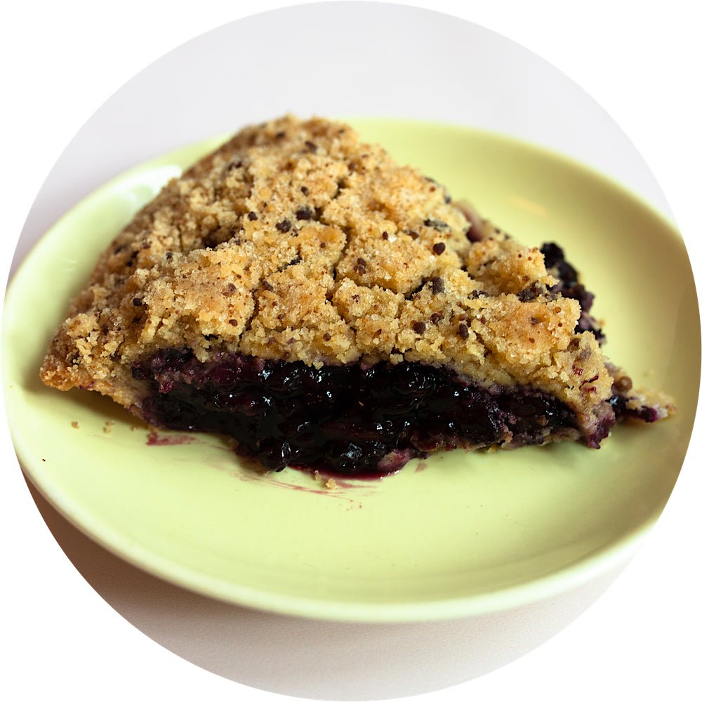 Blueberry crumb pie slice with organic wild berries and pecan crumb from Petee's NYC